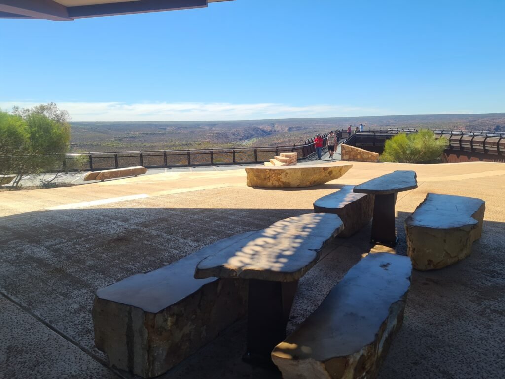 Outdoor seating and picnic tables at Kalbarri Skywalk with scenic views